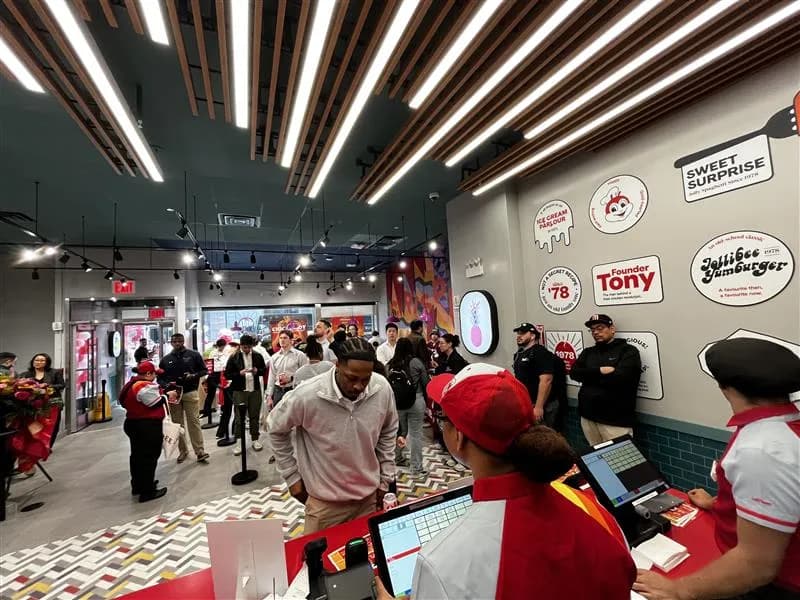 Customers fill a new Jollibee store in Manhattan on opening day