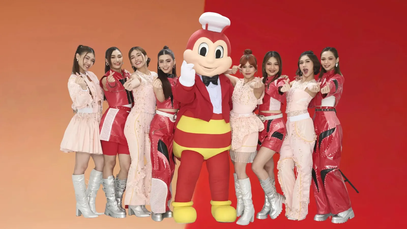 The eight members of BINI posing with the Jollibee mascot