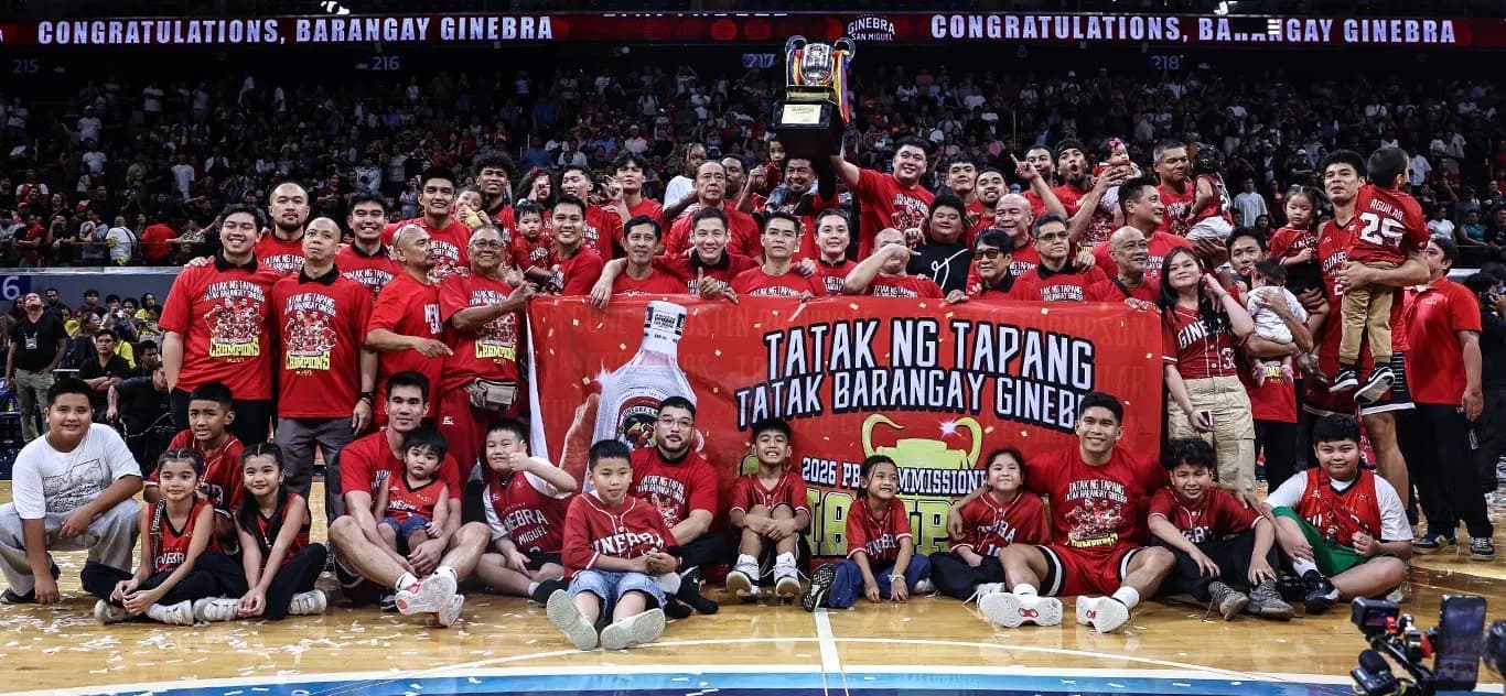 Barangay Ginebra players, staff and families celebrate a PBA title on court