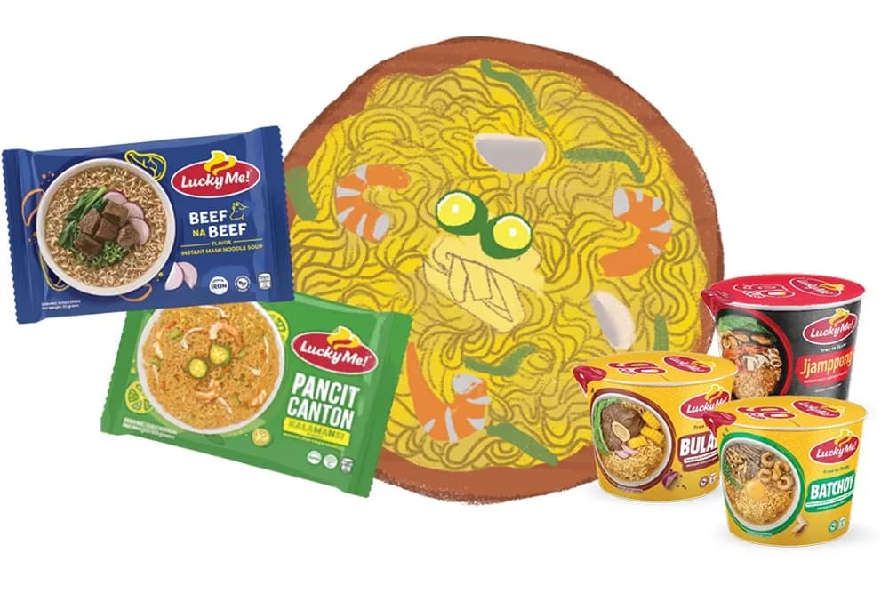 Lucky Me! noodle packs, including Pancit Canton, beside a plate of stir-fried noodles